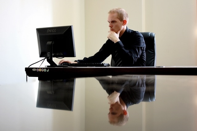 Picture of male employee working at computer